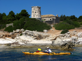 kayaking in front of the old lighthouse in Fiskardo